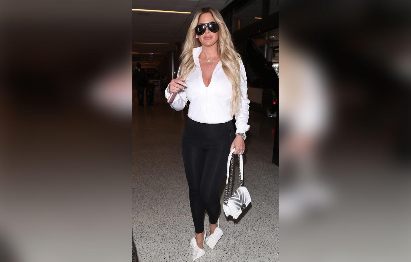 Kim Zolciak makes a sexy arrival as she is spotted at LAX with husband Kroy