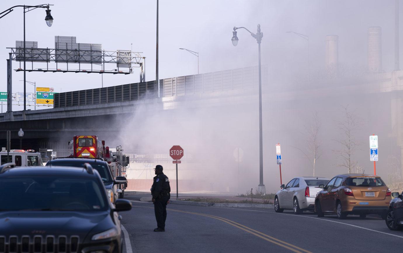 Police and firefighters respond to a fire at a homeless encampment near the U.S. Capitol in Washington, DC on Monday, January 18, 2021. The fire caused a security lockdown during the inauguration rehearsal.