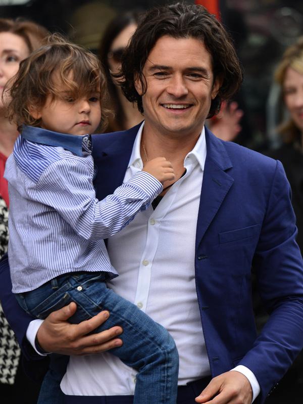 Orlando Bloom holds on to his young son Flynn as he gets a star on the Hollywood Walk of Fame in Hollywood, CA