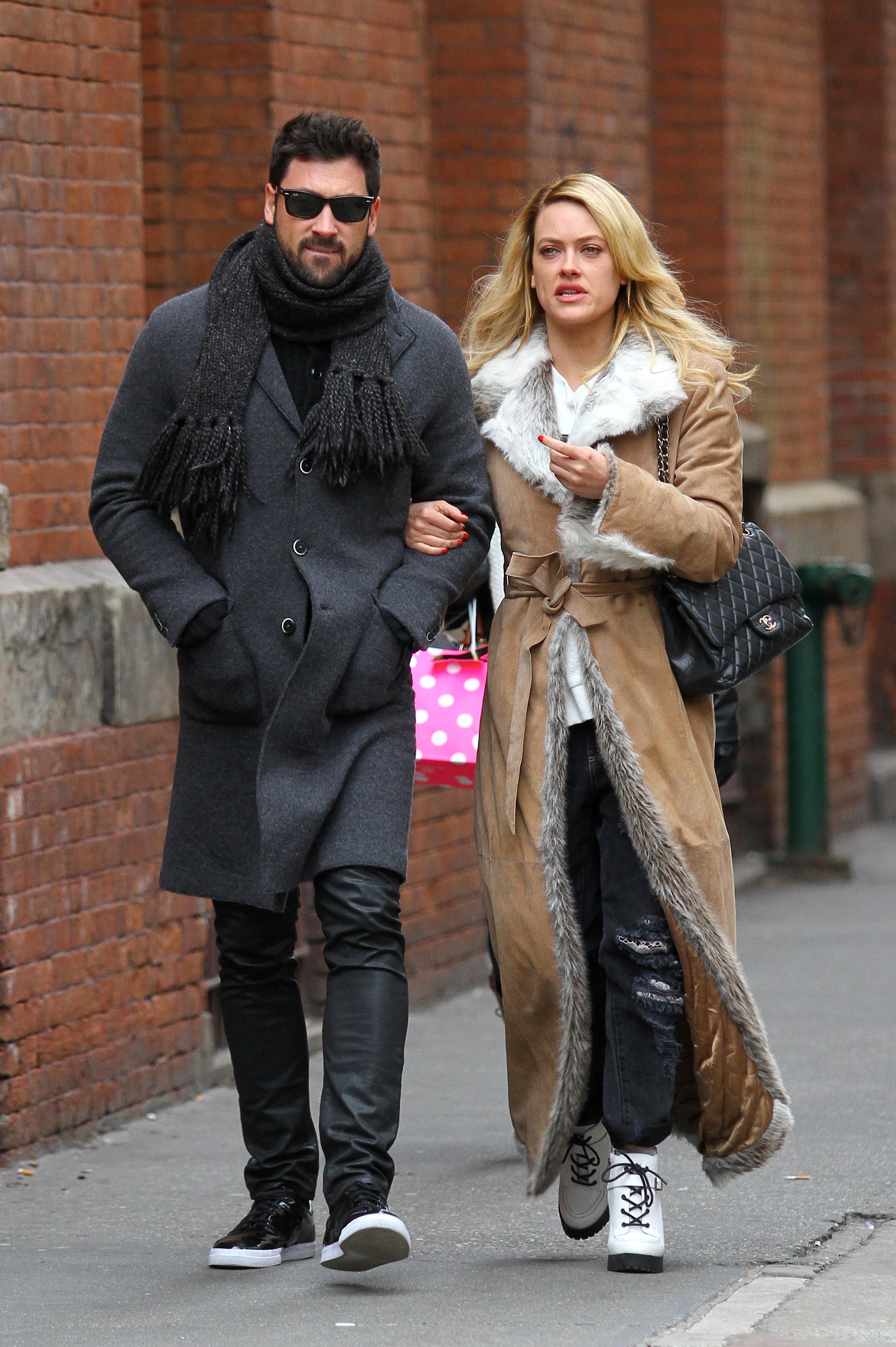 Maksim Chmerkovskiy and Peta Murgatroyd bundle up in chilly NYC **USA ONLY**