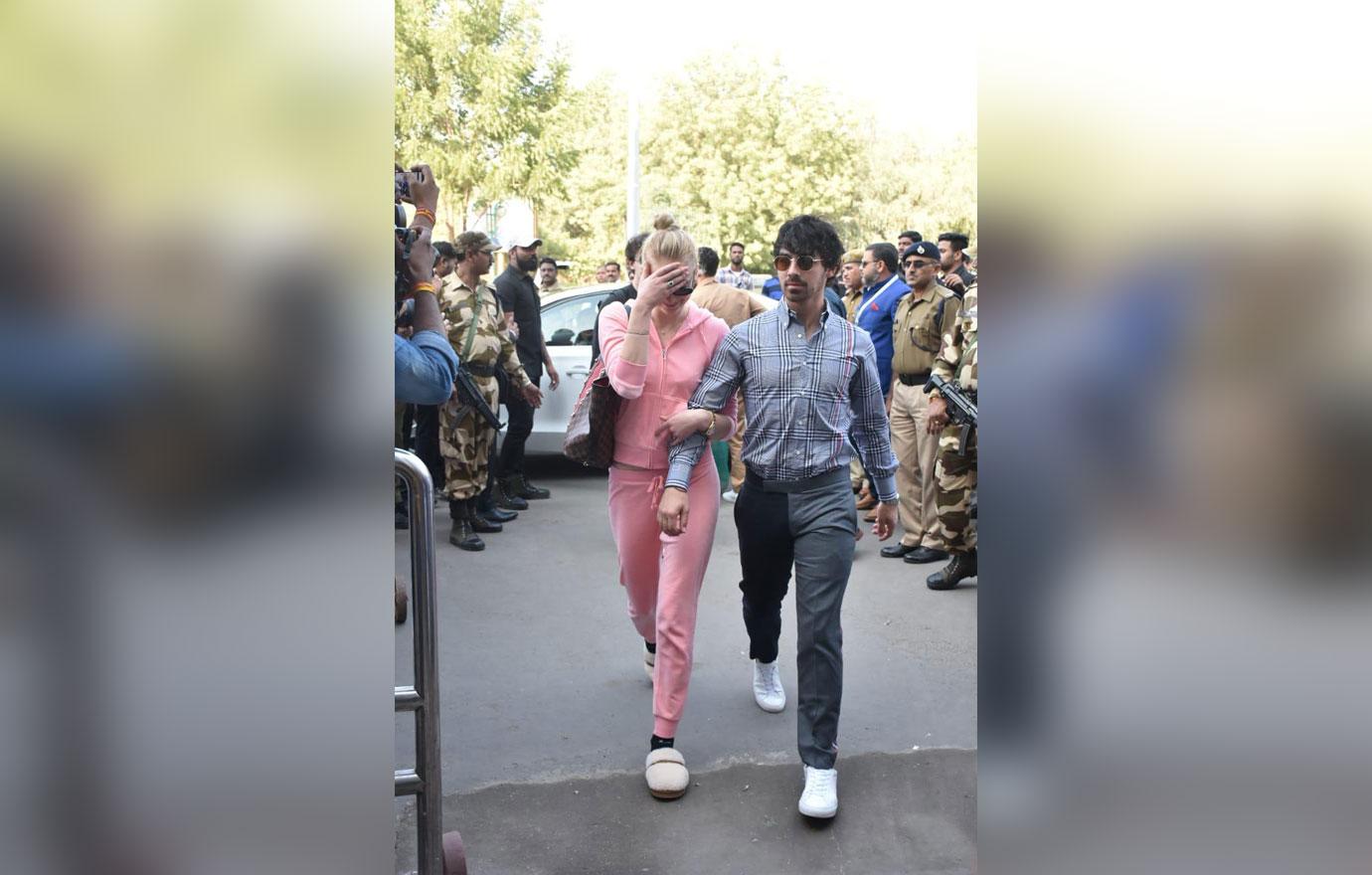 Sophie Turner dressed in a pink tracksuit and fluffy slippers seen at Jodhpur airport after her fiancé Joe&#8217;s brother Nick Jonas got married to  Priyanka Chopra