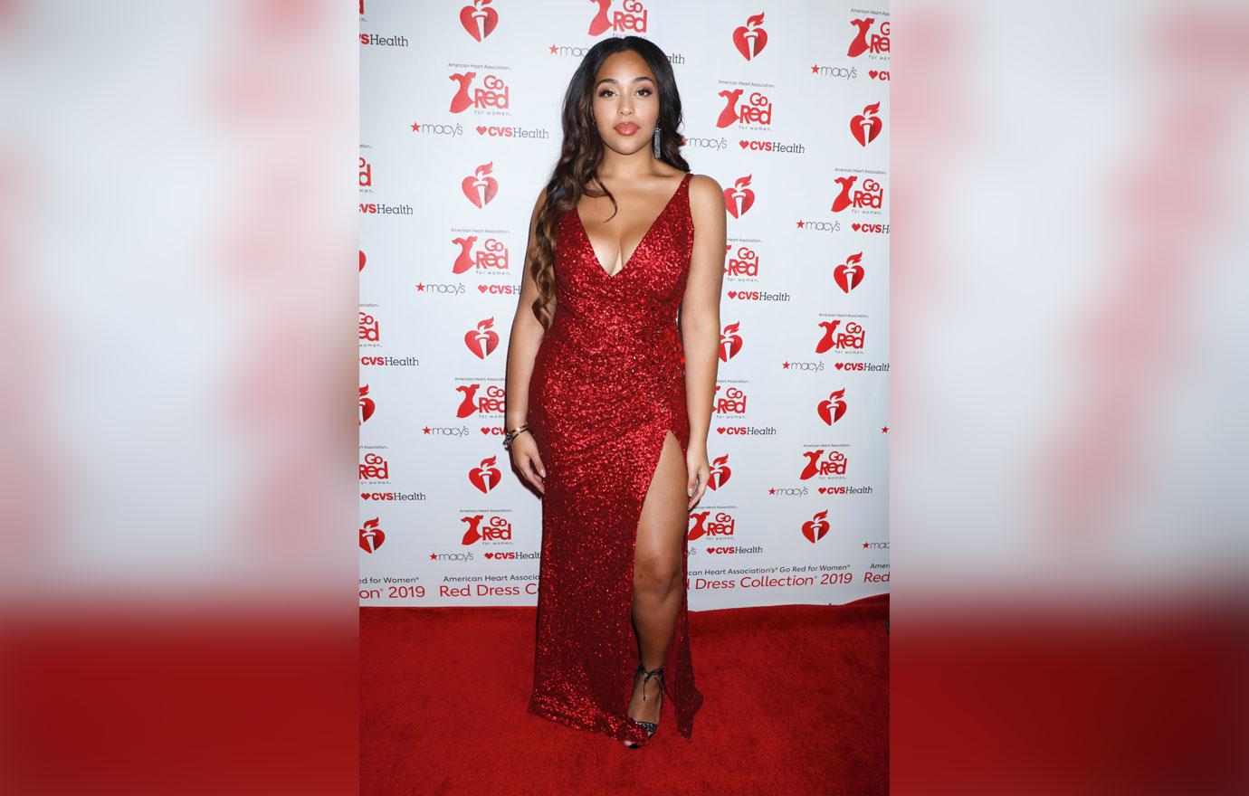 Jordyn Woods Debuts Red Hair in Bold Sheer Dress & Louboutins – Footwear  News