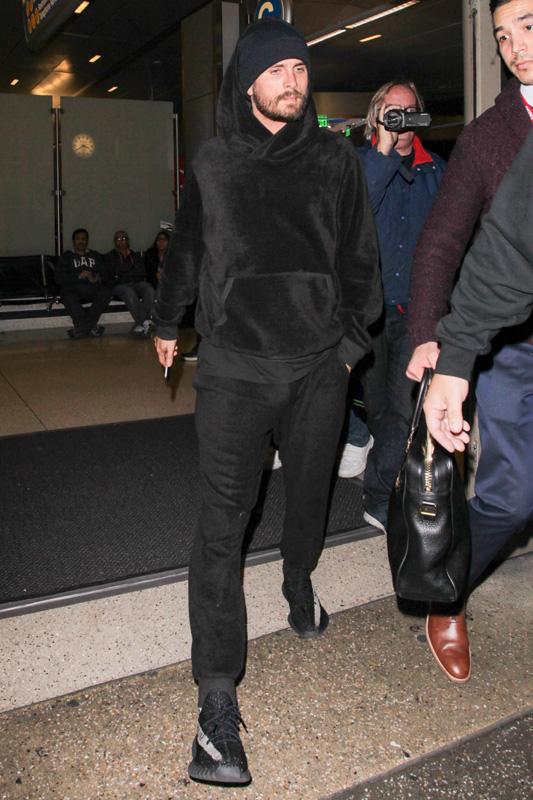 Scott Disick arrives back in LA after a quick trip with Kim to Dubai