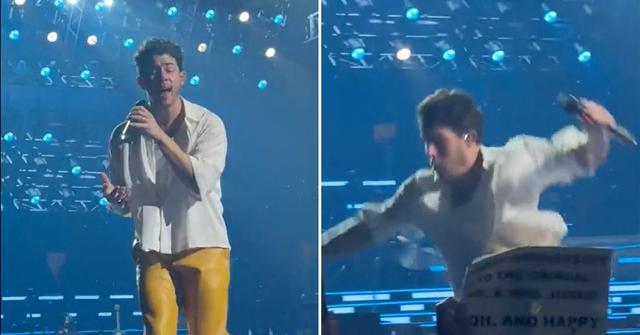 nick jonas falls onstage hole boston concert pops back up watch