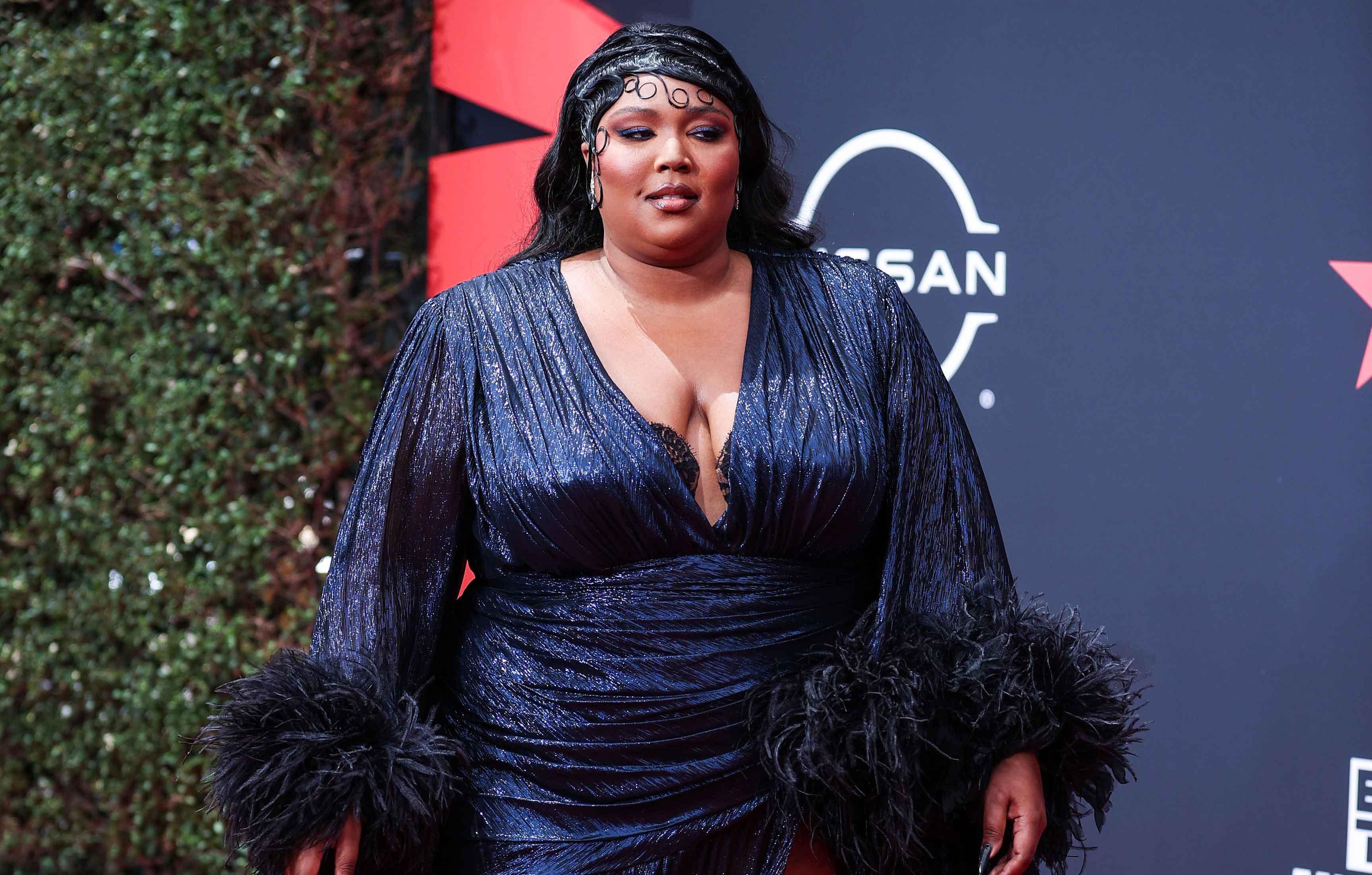 Lizzo Claps Back At Fan Who Asks What If Someone Wears A Fat Suit After  She Dresses As Chrisean Rock