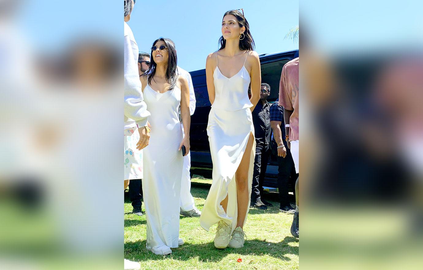 Kendall Jenner, Kourtney Kardashian, and Kim Kardashian hang out at Coachella with other celebs in Indio, CA.