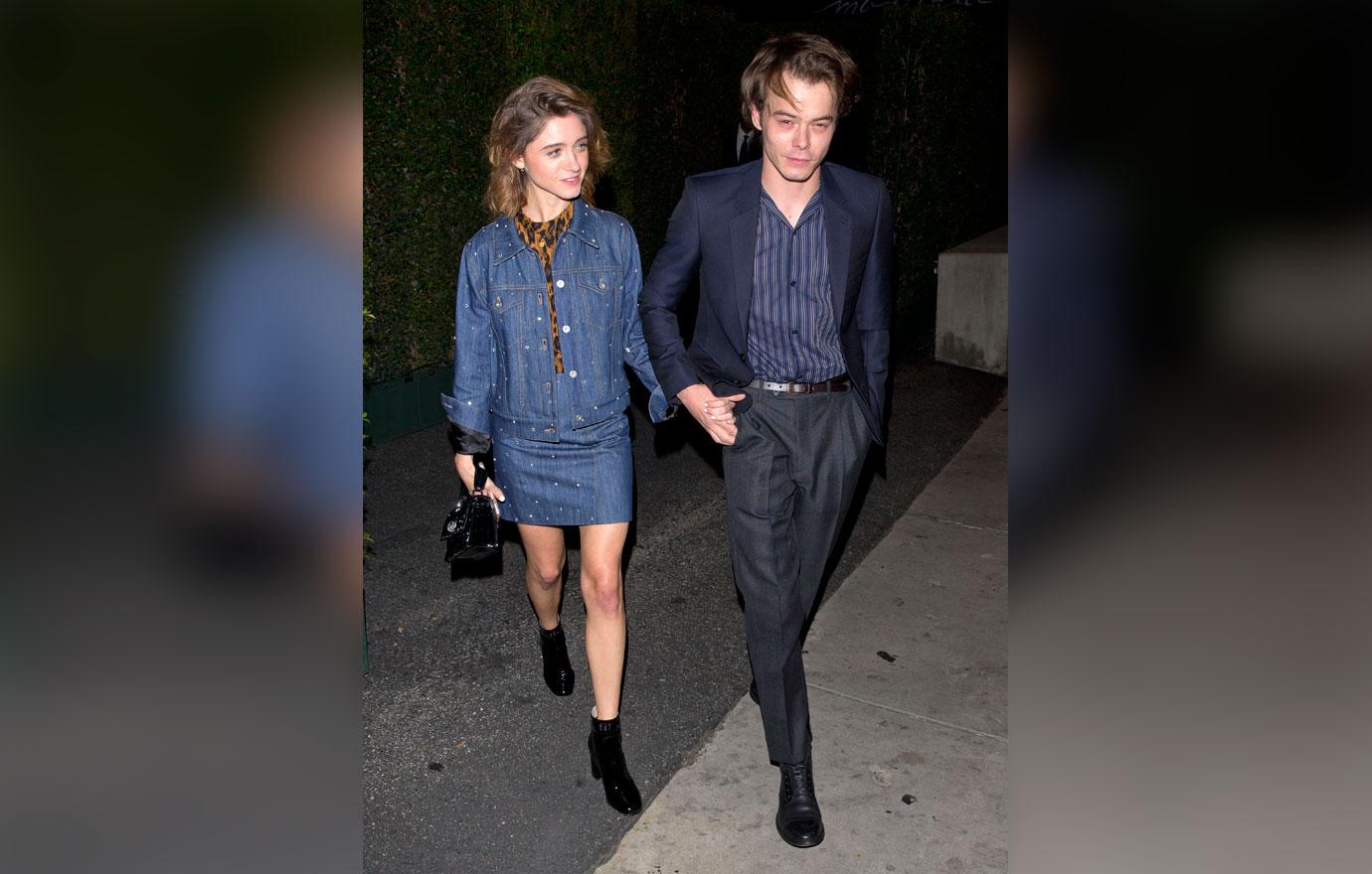 Natalia Dyer and Charlie Heaton hold hands as they leave the &#8216;MIU MIU&#8217; clothing launch in West Hollywood, CA