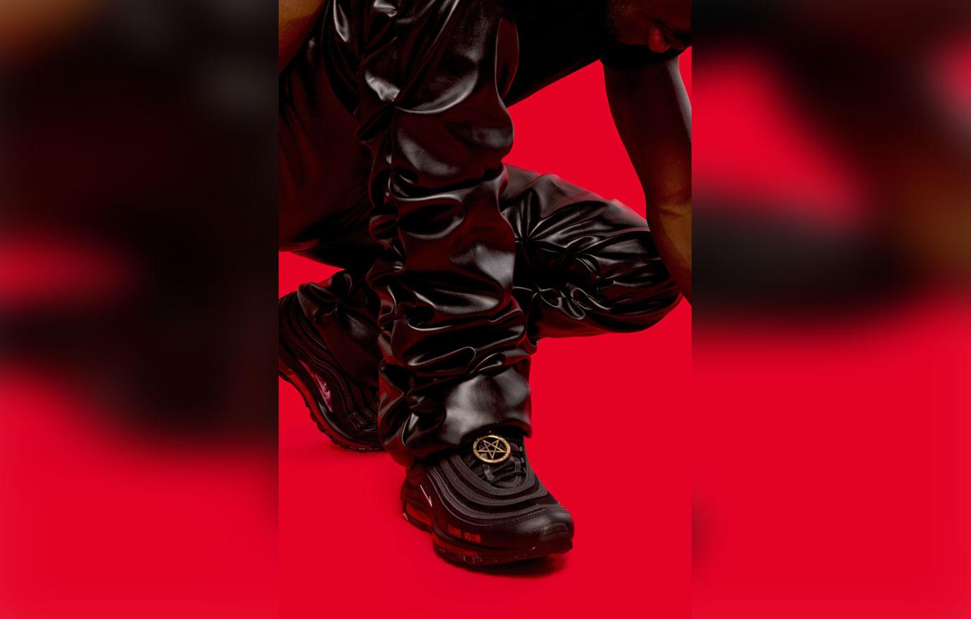 lil nas x poses with his custom satan shoes