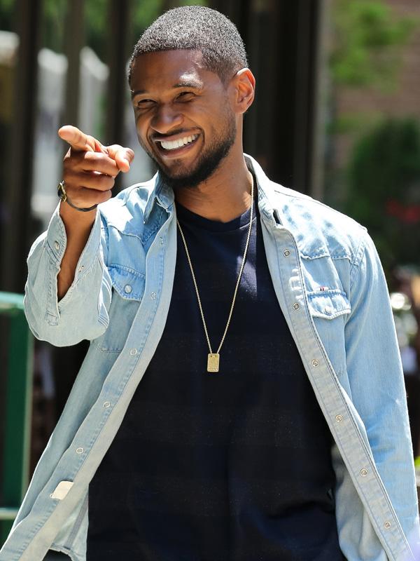 Usher leaves his downtown hotel in New York City