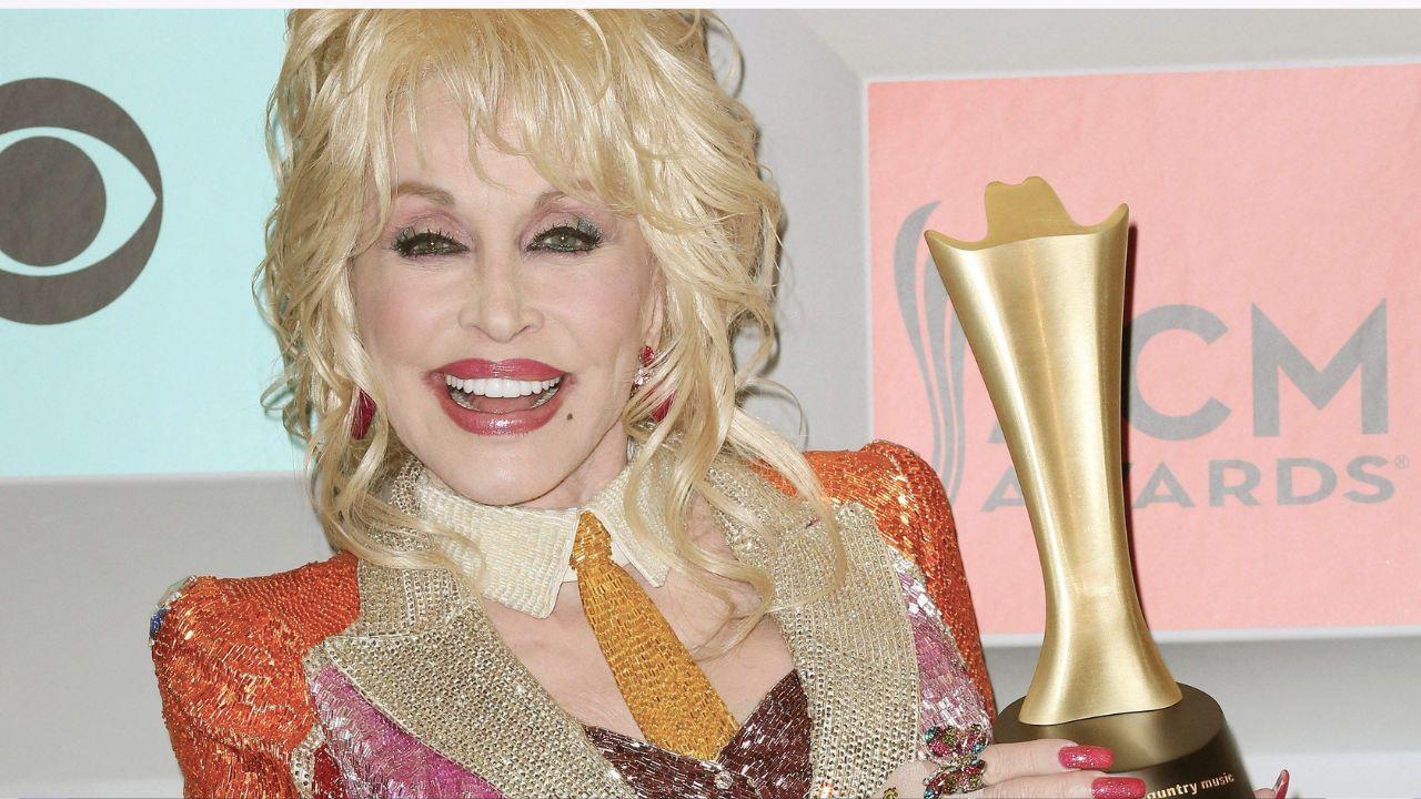 Image of Dolly Parton holding an award