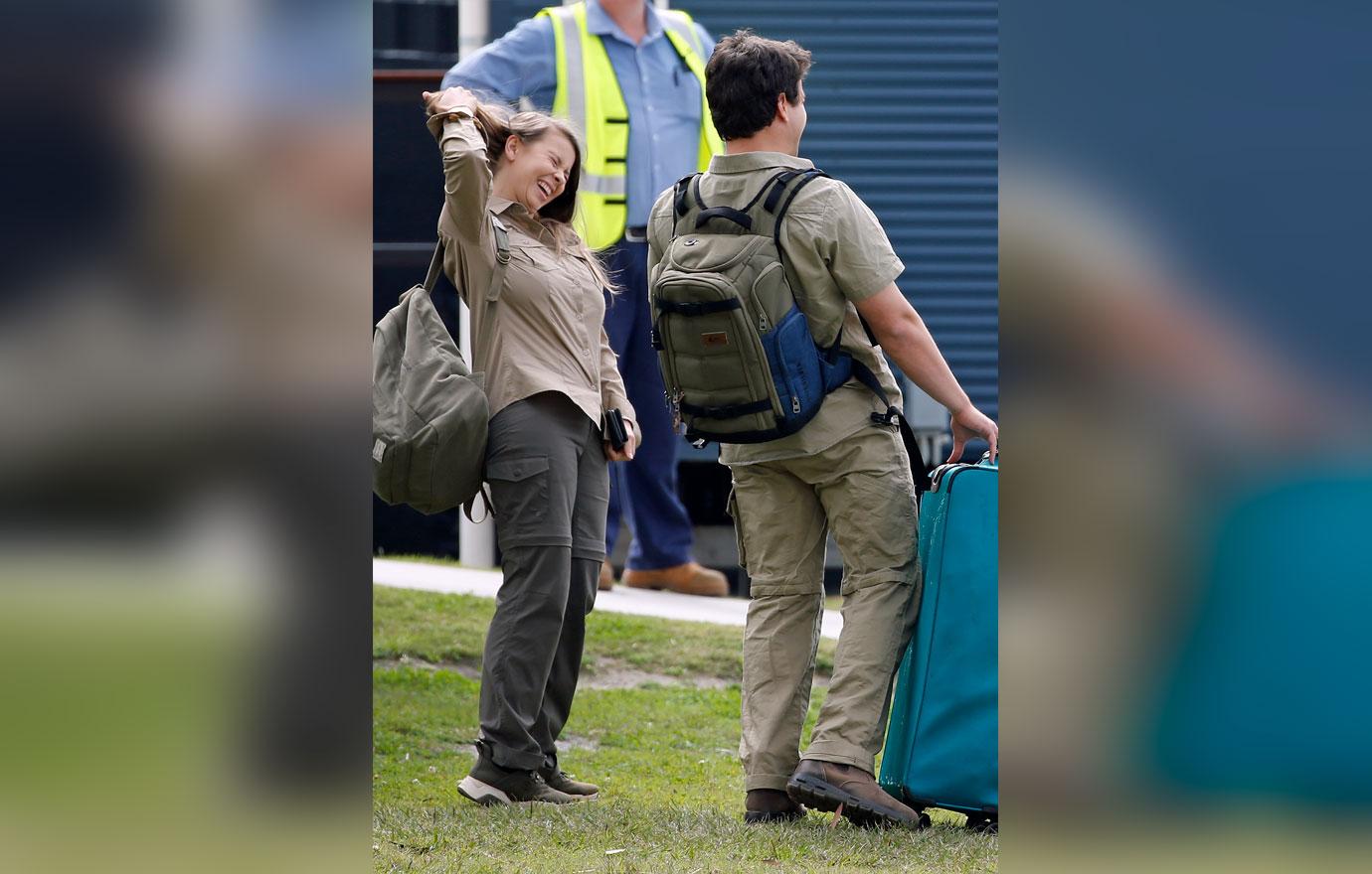 Pregnant Bindi Irwin and Chandler Powell at airport on the anniversary of Steve Irwin's death