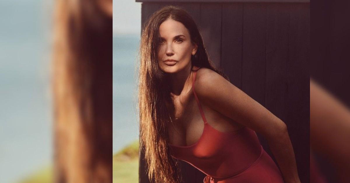 Demi Rose turns up the heat in a red lace bra and matching corset