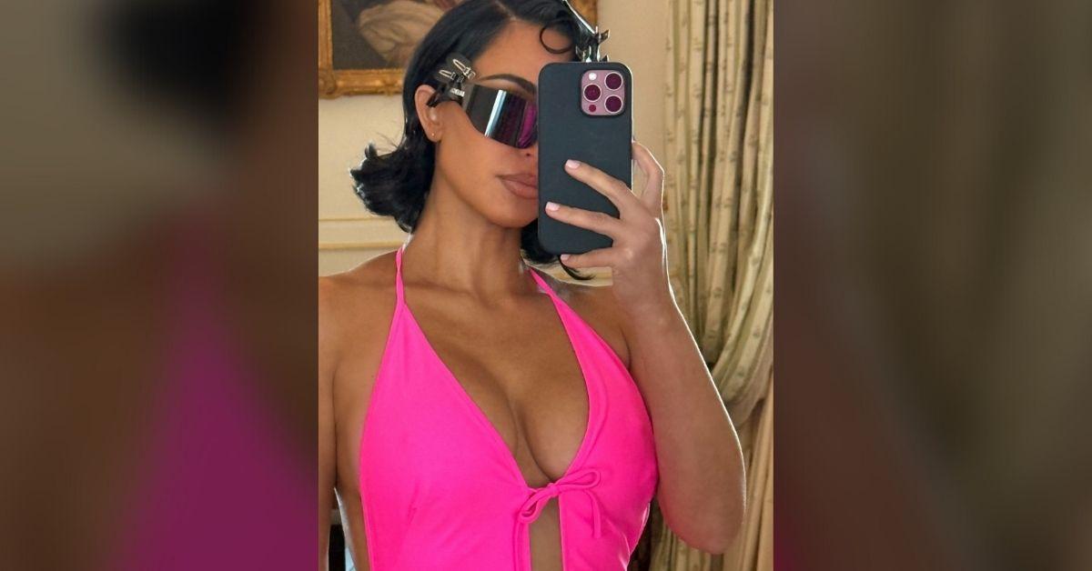 kim kardashian busts out tight neon pink dress paris fashion show