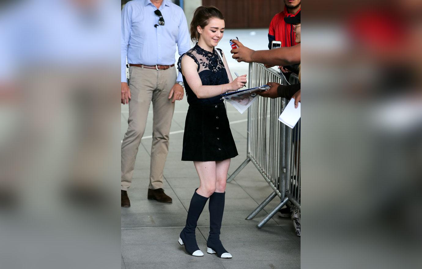 Maisie Williams signing autographs