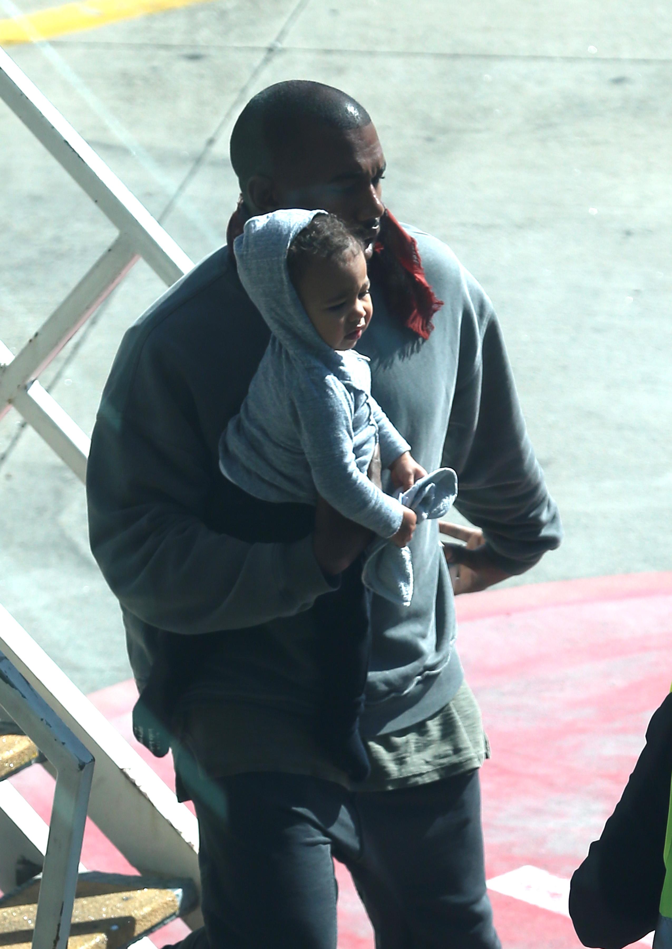 Kim, Kanye and baby North arrive into Sydney, Australia