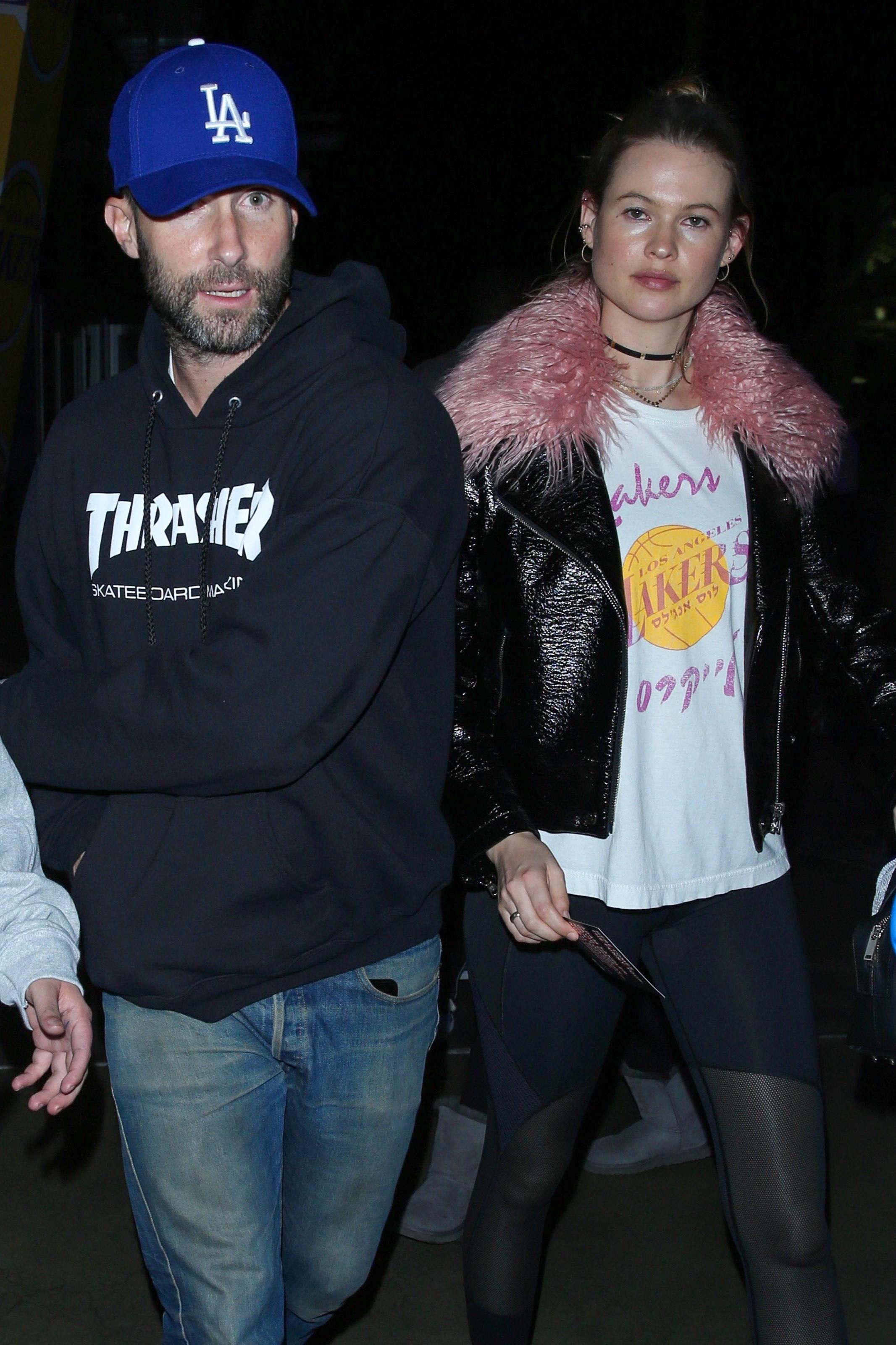 Adam Levine and Behati Prinsloo depart the Staples Center after the Laker game