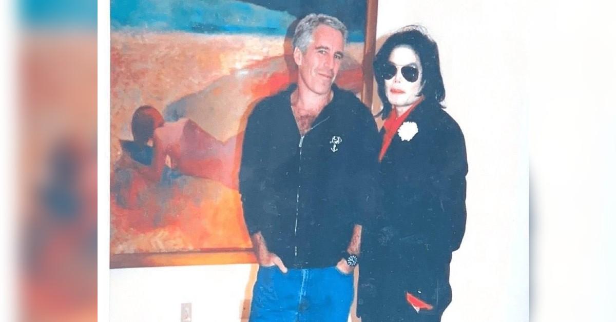 Image of Michael Jackson posed in front of an inappropriate painting.