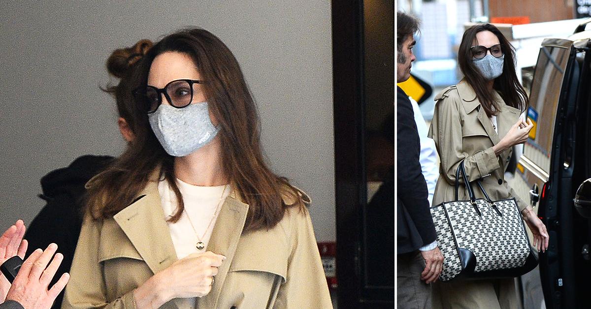 Angelina Jolie cuts a chic figure in a trench coat and rocks a Celine bag  as she leaves her hotel to film biopic Maria in Paris