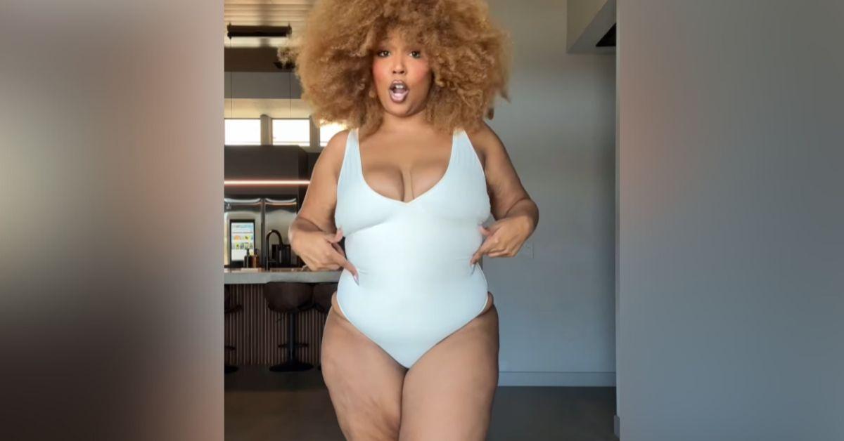 lizzo flaunts dramatic weight loss tiny purple bikini photos