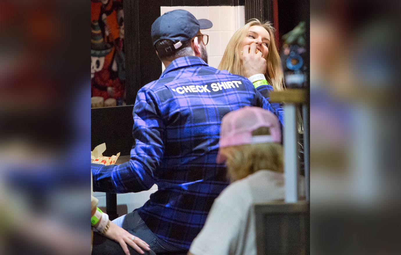 Alex Pall feeds his new girlfriend a burger before they go and see Singer Harry Hudson perform at the El Rey Theater in Los Angeles, CA