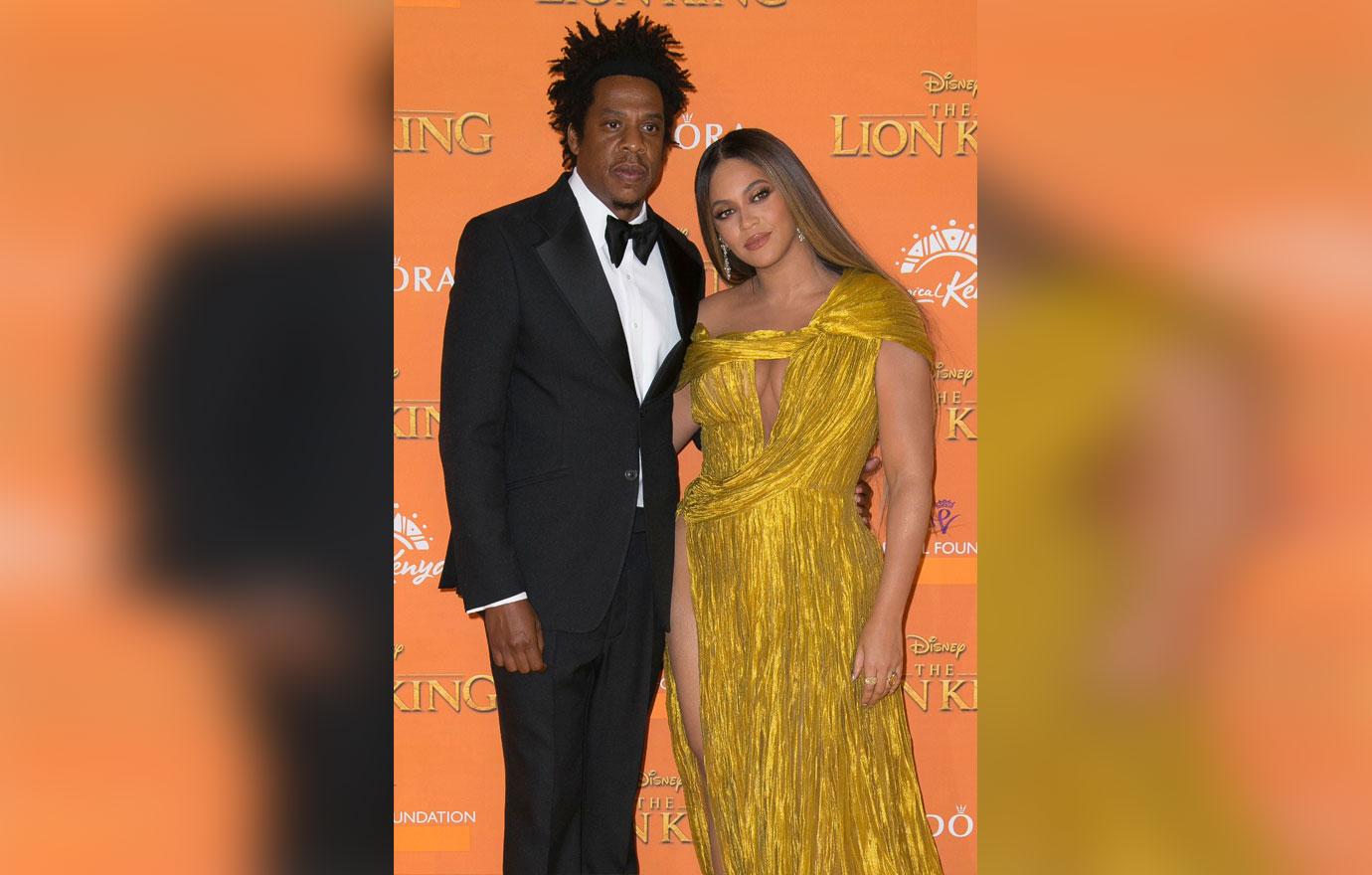 Jay-Z, Beyonce. Singers Jay-Z, left, and Beyonce pose for photographers upon arrival at the 'Lion King' European premiere in central London