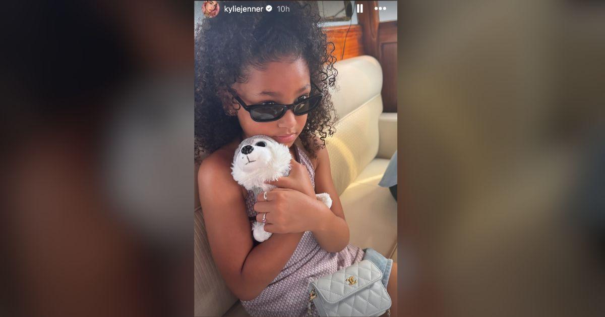 kylie jenner strips down tiny black bikini boating kids photo